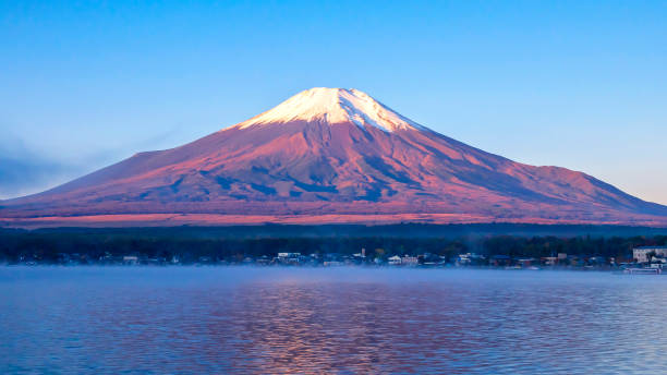 istock Fuji Mountain with lake and tree over blue sky and cloud 1269494914