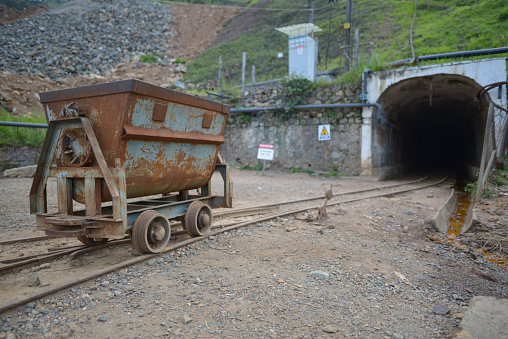 rusty metal wagon at the entrance to a Chinese company owned mine in Kilembe, Uganda
