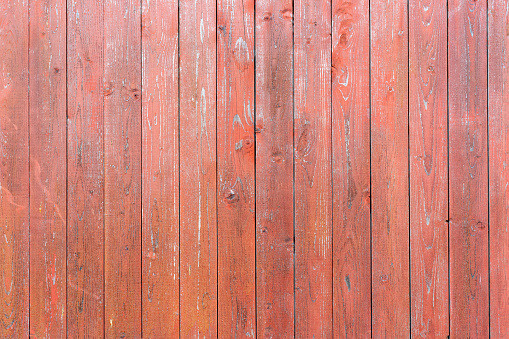 Old vintage wood planks. Red-brown wooden fence.