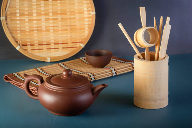 istock Chinese traditional clay teapot and tea ceremony items on blue table 1269496928
