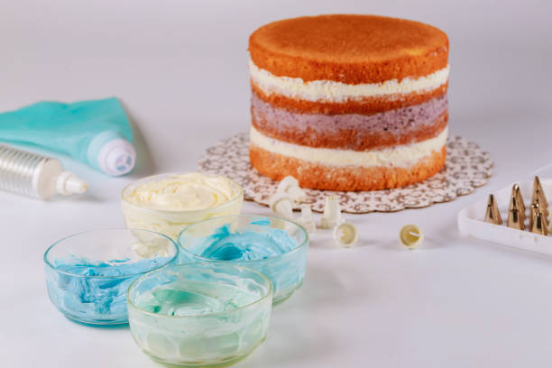 istock Blue and white icing with icing bag and tips for decoration. 1269498471