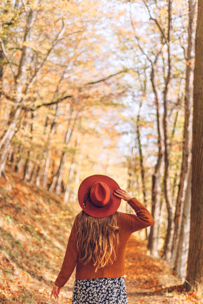 istock Woman in the autumn forest 1269500196