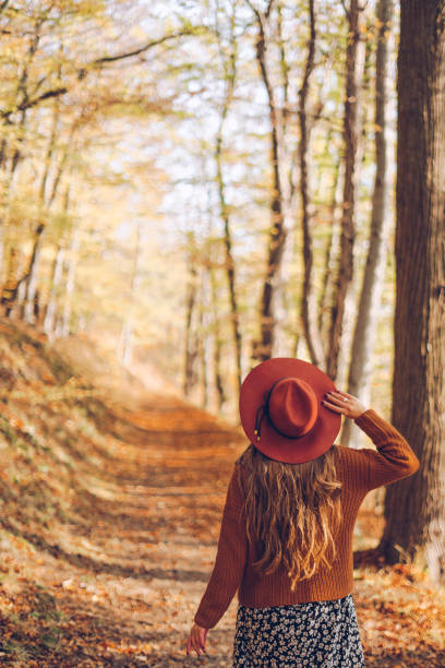 Woman in the autumn forest