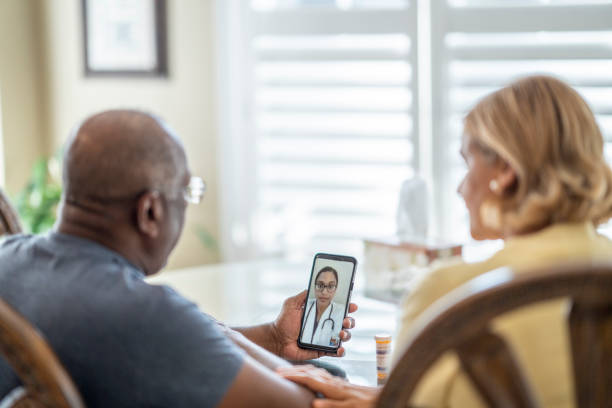 istock Couple speaking with their doctor via video call 1269501097