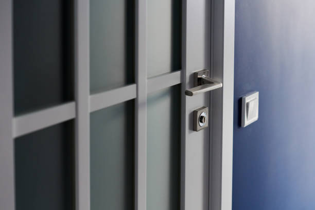istock White interior door with handle. Blue wall in modern apartment 1269503179