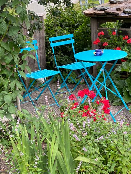 Blue small round table and two chairs in the garden