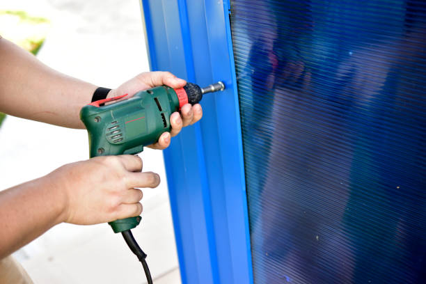 istock Working with a hand drill screwing bolts into the wall 1269507226