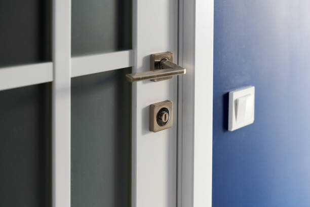 istock White interior door with handle. Blue wall in modern apartment 1269508524