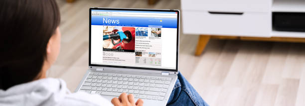 istock Watching News On Laptop Computer Screen Online 1269509473