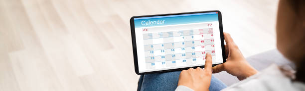 istock Woman Looking In Calendar 1269509499