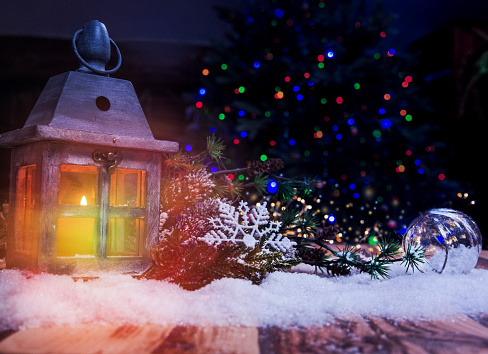 Christmas Lantern On Snow With Defocused Lights