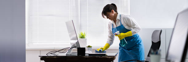 istock Janitor Cleaning Office Desk 1269511038