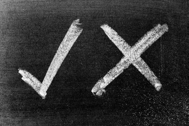 istock White color chalk hand drawing in check mark of right and wrong shape on black board background 1269511145