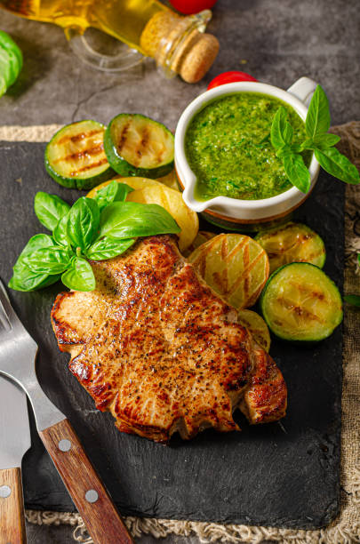istock Delicious pork steak with herbs sauce 1269513264