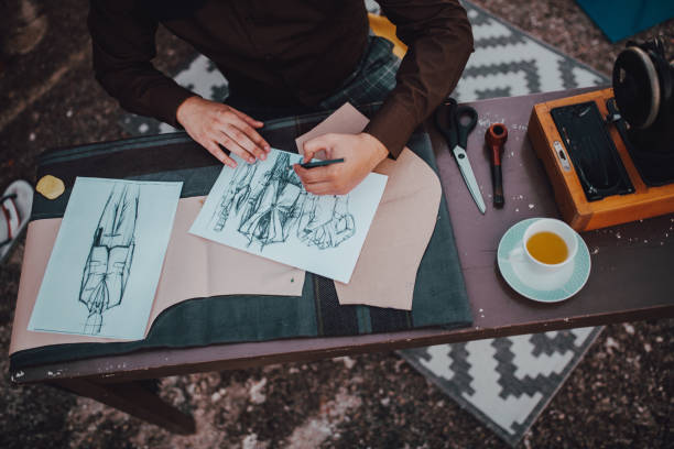 istock Male tailor sketching in clothing design studio 1269513296