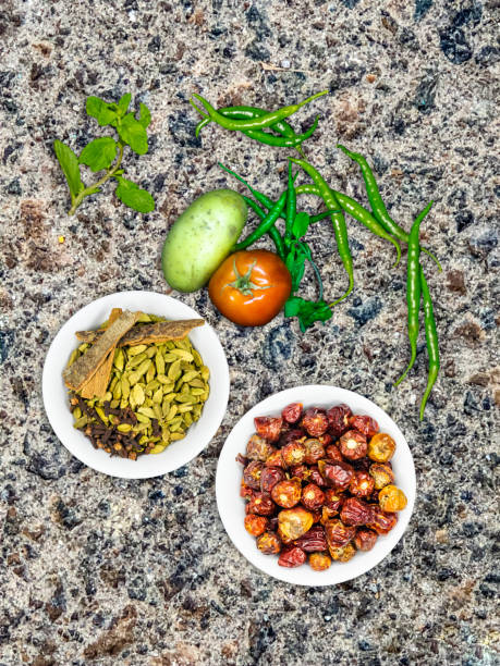 istock mix vegetables in concrete background along with red chilli and spices, tomato, green chilli, potato, mint and small shallot 1269513902