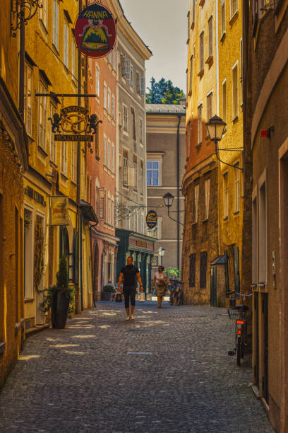 Salzburg, Austria - September 15, 2020 - Salzburg beautiful alleys with restaurants and tourists walking