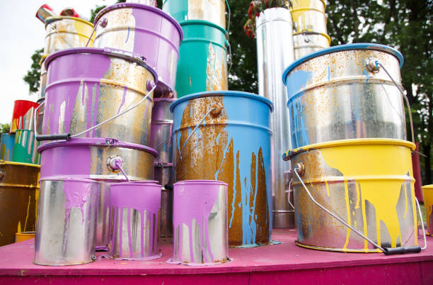 istock The used paint cans. Many multi-colored buckets with traces of paint on them 1269516714