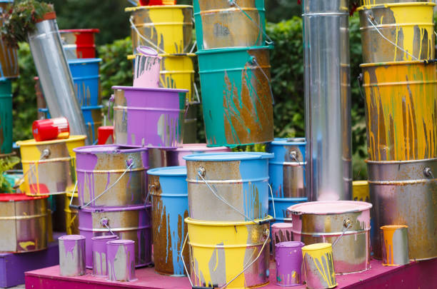 istock The used paint cans. Many multi-colored buckets with traces of paint on them 1269516804