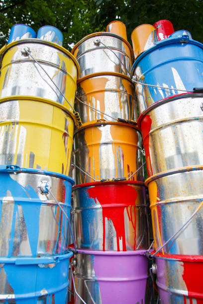 istock The used paint cans. Many multi-colored buckets with traces of paint on them 1269516834