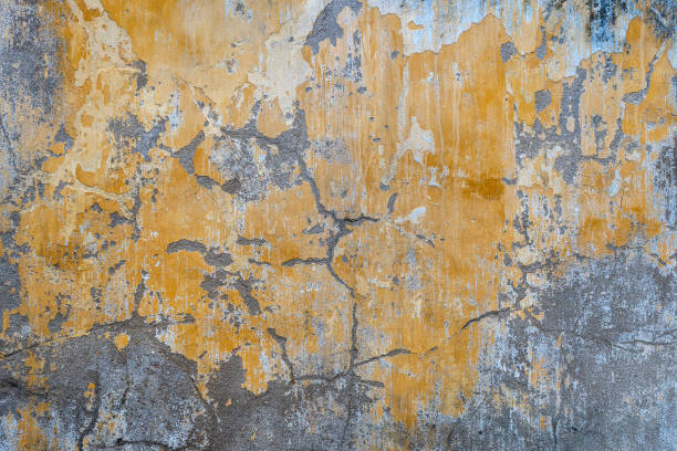 istock Background of old yellow painted wall texture 1269516845