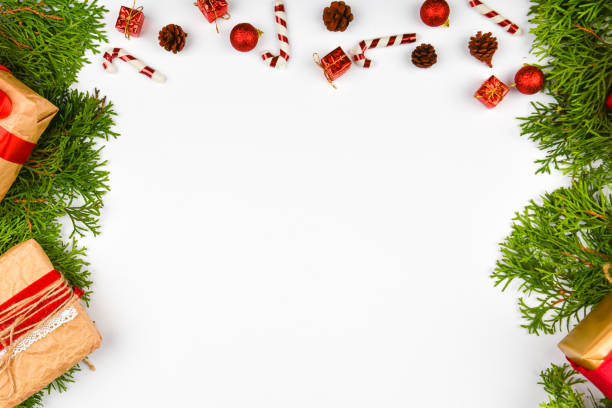 istock Christmas composition on a white background. Flat space. Gifts, fir branches, red decorations on a white background. Christmas, winter, new year concept. Top view, copy space 1269517041