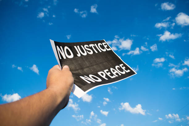 istock A protestor holds a banner with 