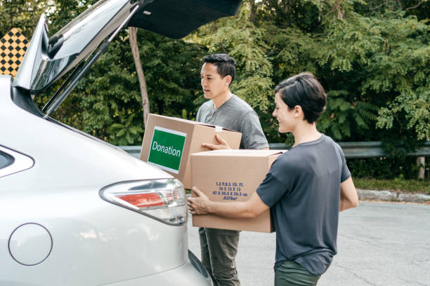 istock Moving Day- couple loading the car with cardboard boxes 1269518266