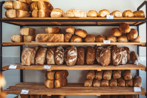 istock Fresh bread on shelves in bakery 1269519380