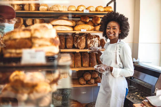 istock Small Bakery shop owner standing in front of store 1269519754