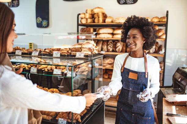 istock Customer making a credit card payment in a bakery. 1269519756