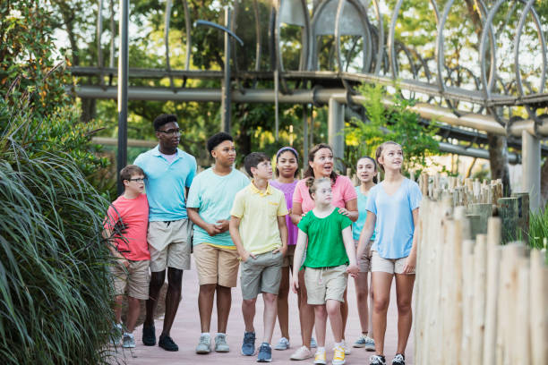istock Summer field trip to zoo, including children with downs 1269522076