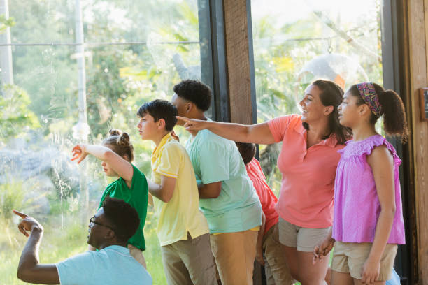 istock Summer field trip to zoo, including children with downs 1269522131