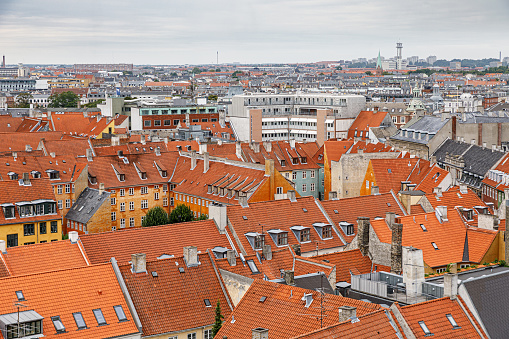 Copenhagen, Denmark, August 5, 2020: View over the old part of Copenhagen from a tall building with a view to the traditional red roofs