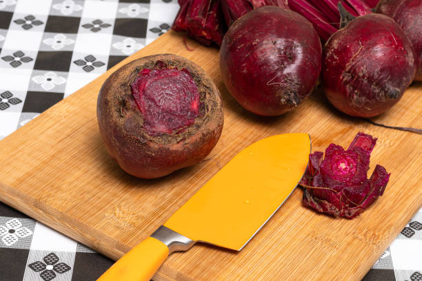 istock ORGANIC BEET ON A TABLE WITH BLACK AND WHITE PLAID TOWEL 1269530138