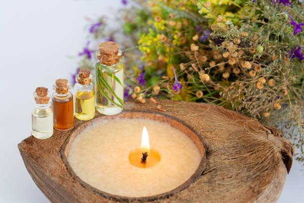istock SPA set with herbal essential oils, burning candle and healthy wildflowers 1269533103