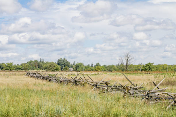 istock Picket Fence And A Cloud Filled Sky 1269536484