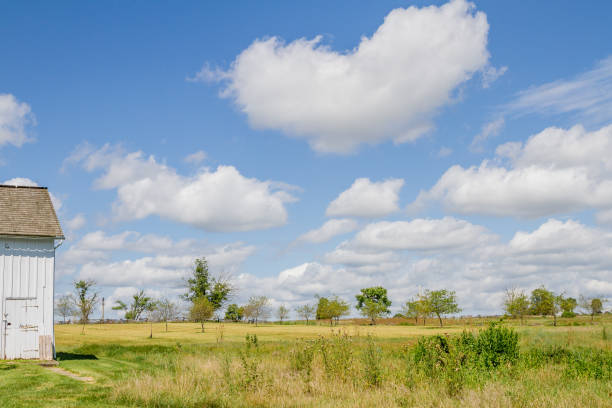 istock Corner Of Old House, Dramatic Clouds And Large Field 1269536816