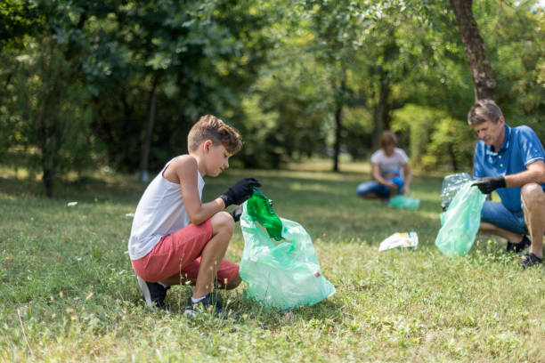 istock People picking litter in nature 1269544448