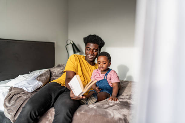 istock Father reading story to his son 1269546016