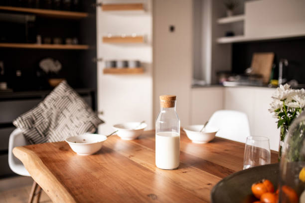 Breakfast Kitchen table set for breakfast milk bottle milk bottle empty stock pictures, royalty-free photos & images