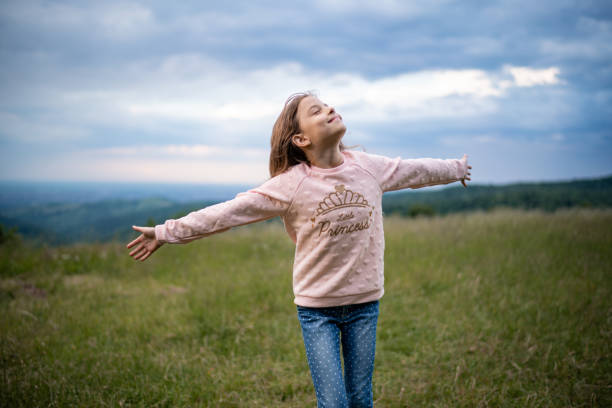 istock Smiling girl walks in nature 1269548097
