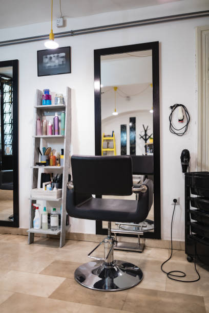 istock Empty hair salon interior with chairs and mirrors. 1269549923