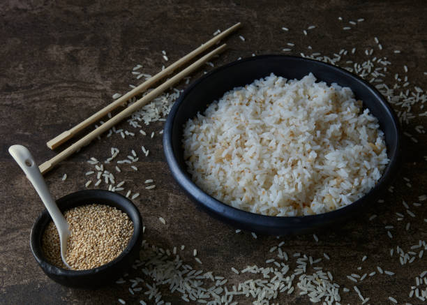 istock Bowl of cooked white rice and seeds 1269550479