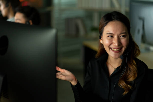 istock employee customer service representative working as technical support call center in the office with headphone computer overtime in the night 1269550807