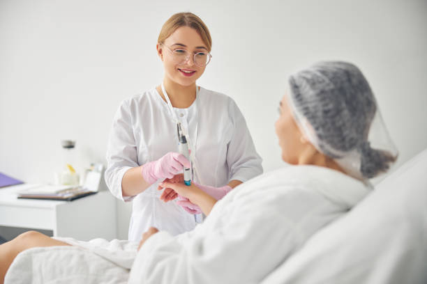 istock Friendly young dermatologist conducting a cosmetic procedure 1269556734