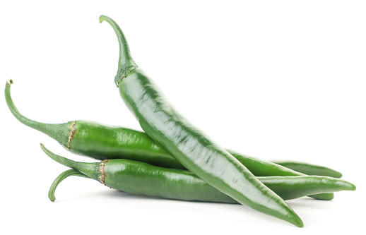 Group of green hot chili peppers close-up on a white background. Isolated
