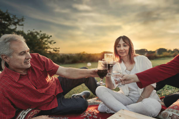 istock Mature couples eating outdoors 1269560380