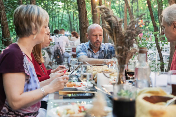 istock Mature couples eating outdoors 1269560472