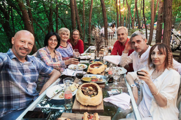 istock Mature couples eating outdoors 1269560520